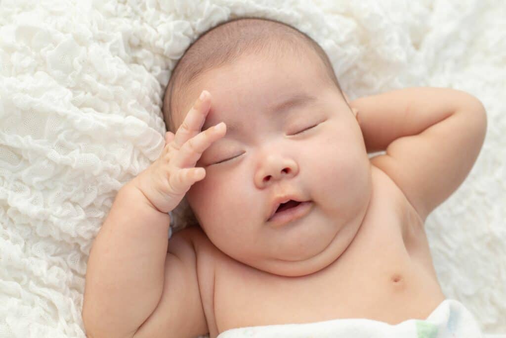 Baby Sleeps with Hands Behind Their Head: Is it Normal?