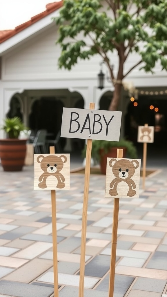 Wooden signs with teddy bears and the word 'BABY' for a baby shower.